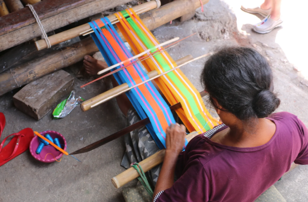 A woman working on Sumbanese weaving