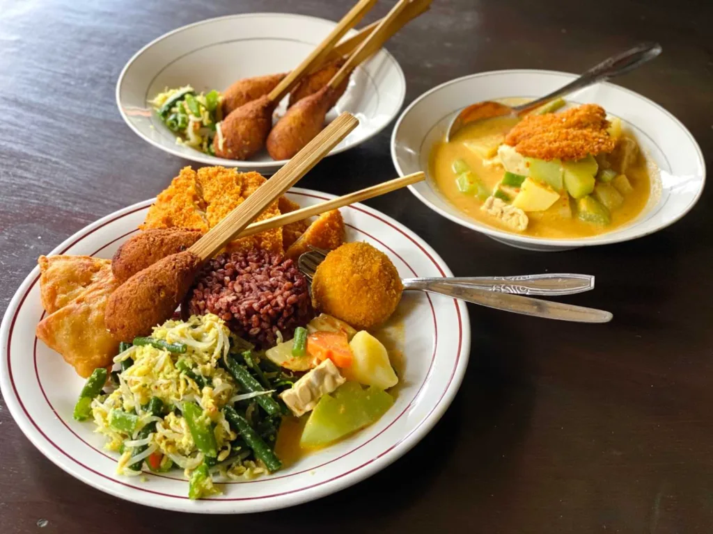 A plate of delicious-looking plant-based food - Best warung in Ubud