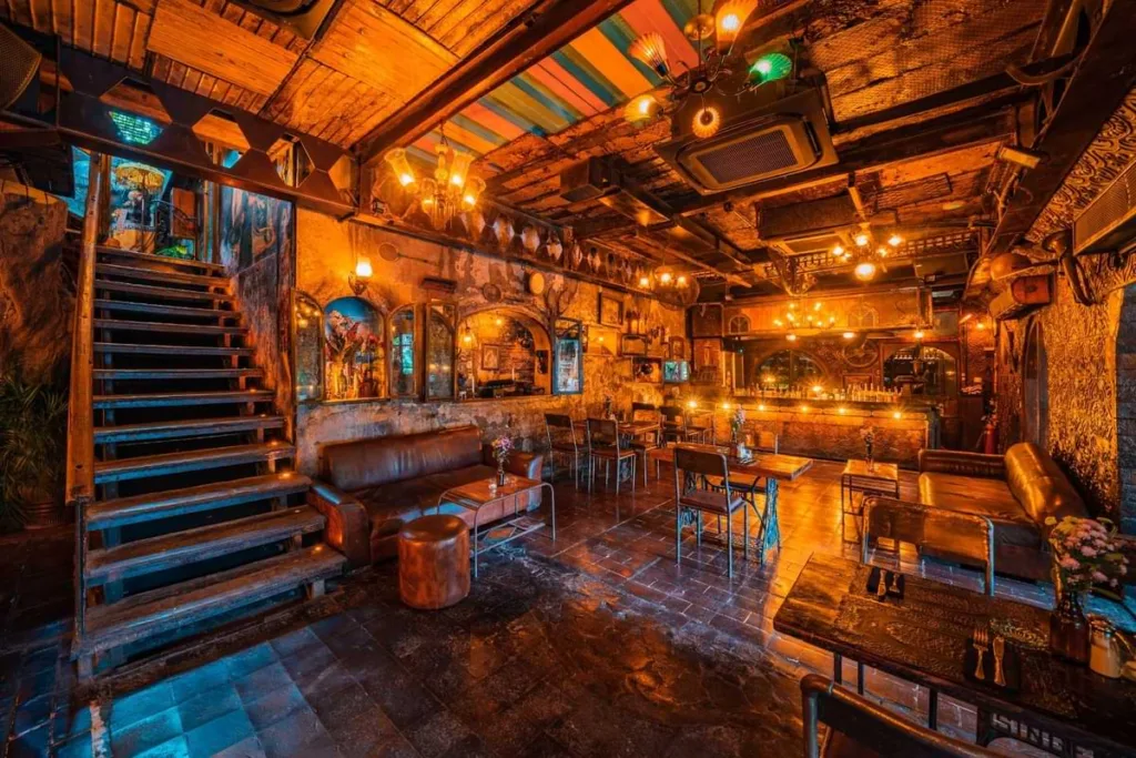 Interior of La Favela bar and restaurant with eclectic decor, warm lighting, and vintage furnishings