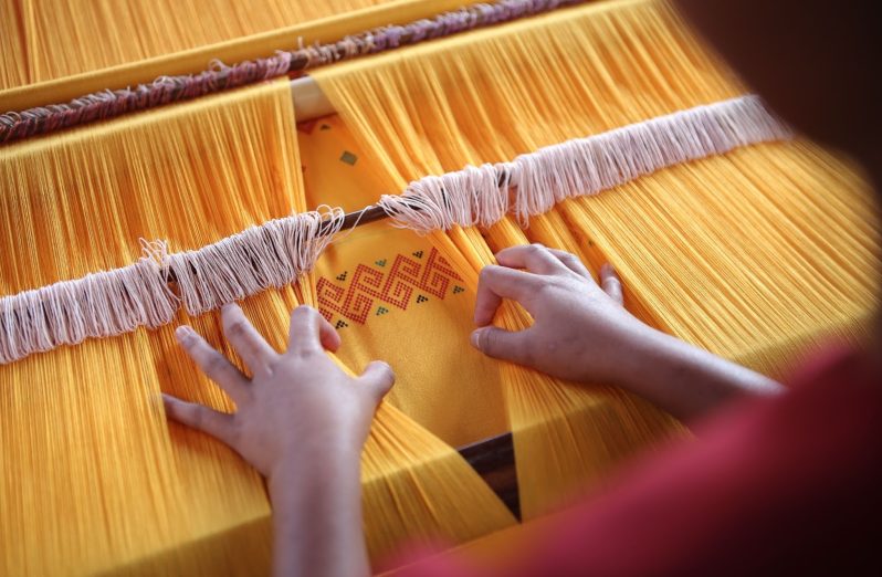 Sumbanese weaving in orange fabric