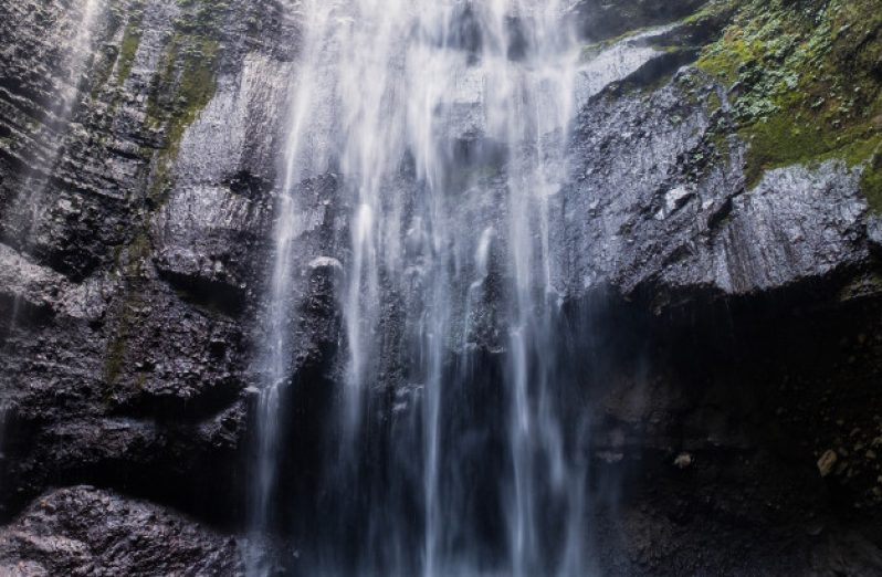 majestic-waterfall-flowing-rocky-cliff-tropical-rainforest_49071-198
